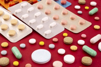 Different colorful pills and capsules in packs - blisters. Global pharmaceutical industry for