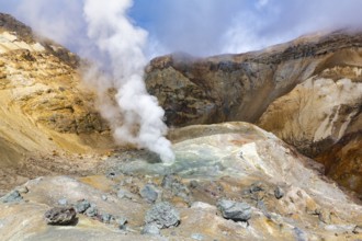 Scenery view of crater of active volcano, amazing volcanic landscape: hot spring and fumarole, lava