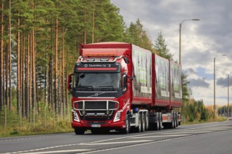 Red Volvo FH of Uusioaines Oy hauling trailer load of Foamit foam glass aggregate along highway 2.