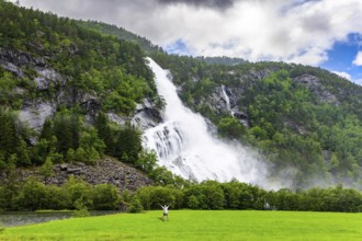 Incredible waterfalls in Norway. Huge powerful waterfal Vidfossen. White water foam envelops the