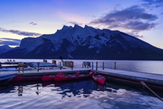 Beautiful autumn landscape scene in lake and mountain in background in west Canada, colour kayaks