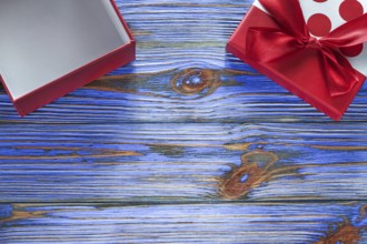 Opened gift box on vintage wooden board