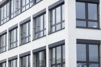 Facade of an modern large house, wall with windows