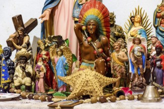 Altar with several images of saints, entities from religions of African origin such as Umbanda and