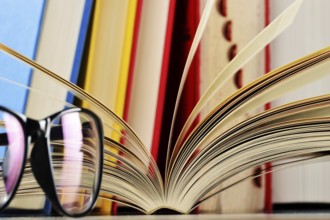 Composition with glasses and books on the table