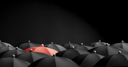 Concept image with lots of black umbrellas and a red umbrella that stands out, be unique