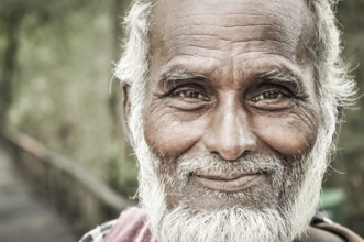 Sunderban, Bangladesh, circa July 2012: Old native man with white beard and hair wears colourful