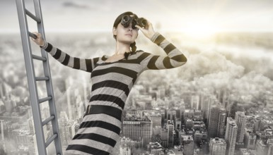woman using a spyglass on top of a ladder
