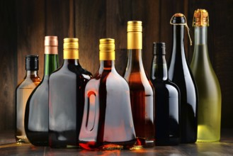 Composition with bottles of assorted alcoholic beverages