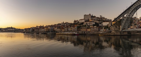 A panorama picture of the Porto cityscape and the Douro river at sunset