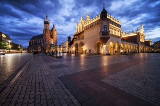 Krakow city in the evening in Poland, Main Square in the Old Town, illuminated St. Mary Church and