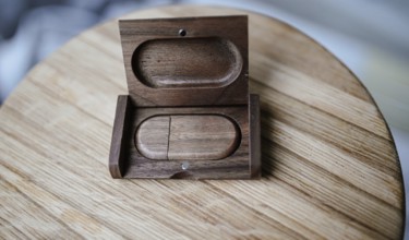 An open wooden case with light wood and minimal style on a wooden tabletop, highlighting natural