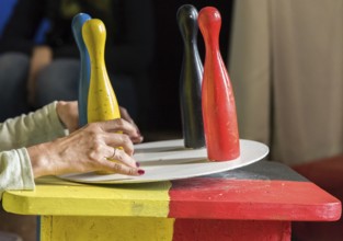 Four colourful game cones are not balanced on a turntable - Germany