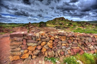 Masonry stonewall in spring with flowers at Menorca Balearic islands