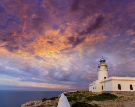 Menorca sunset in Faro Far de Caballeria Lighthouse at Balearic Islands es Mercadal