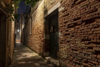 Old Brickwall in a narrow Alley in Cannaregio District, Venice, Italy, Europe