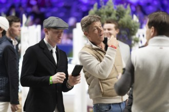 Daniel Coyle of Ireland inspects the course ahead of the 1.60m FEI Jumping World Cup at Jumping