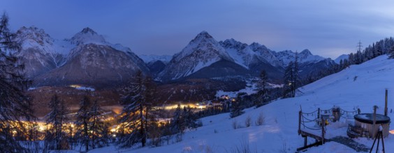 Evening mood, view from a hut with hot pot from Motta Naluns over Scuol towards Val S-charl,