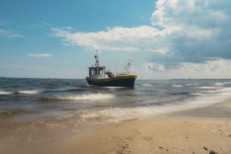 Fishing boat on the beach in Sopot, Poland. Magnificent long exposure calm Baltic Sea. Wallpaper