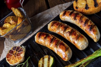 Delicious grilled sausage with various grilled vegetables