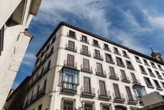 Street in historic center of Madrid, lined with residential buildings
