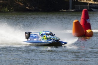 PESO DA REGUA, PORTUGAL - SEPTEMBER 15, 2024: Blue Powerboat Goes Fast with Splashes of Water