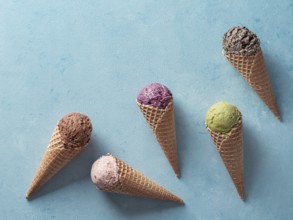 Various ice cream scoops in cones with copy space. Colorful ice cream in cones chocolate,