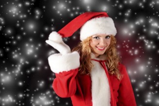Christmas santa girl on black. Copy space. Christmas greetings card