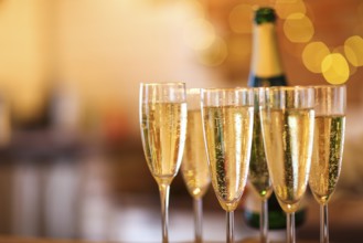 Champagne glasses on gold background. Party and holiday celebration concept