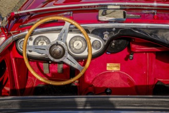 Lisbon, Portugal, Jan 20, 2024: All-red interior of Austin-Healey 100 vintage convertible sports