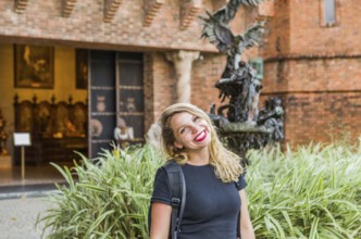 Young blonde tourist in front of Ricardo Brennand Institute in Recife, Brazil, South America