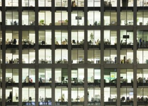 Modern office at night, showing the daily activity of office workers