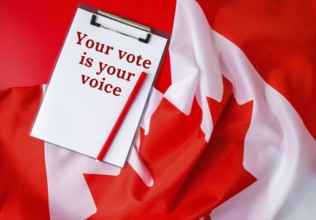 The National Flag of Canada. Canadian Flag or the Maple Leaf with paper note message text. Election