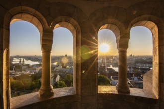 Old historic fortress and church at sunrise. City panorama at dusk. View of the Danube Fishermen's