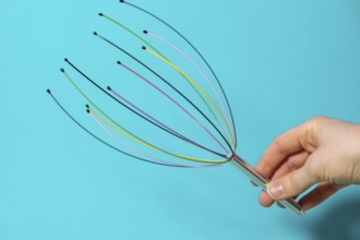 Scalp massager for home. Close up of scalp massaging brush for hair growing routine. Anti stress