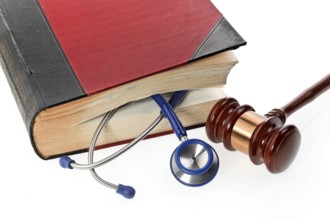 A blue stethoscope lies in a medical book Austria