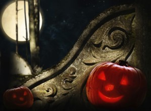 Ancient decorated wall in night forest with big moon and two Halloween pumpkins