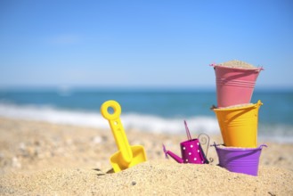Colorful toy buckets at the beach