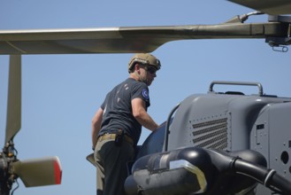 GREYMOUTH, NEW ZEALAND, NOVEMBER 18, 2017: A pilot makes a preflight check on an Air Force NH90