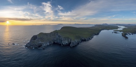 An aerial panorama view of the Bray Head cliffs and headland on Valentia Island at sunset