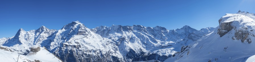 Various alpine peaks including Eiger, Moench, and Jungfrau, seen from the skiing resort Schilthorn