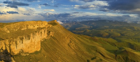 Aerial panorama view of plateau Bermamyt and hills at sunset, North Caucasus mountains, Russia,