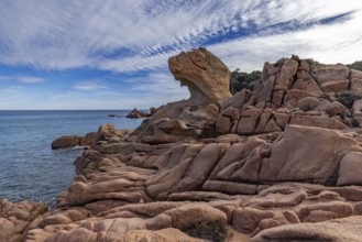 Coastal landscape with bizarre red rocks and sea view, Spiaggia di Cala E'Luas, Ogliastra,