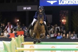 Jessica Burke of Ireland competes in the equestrian Audi Grand Prix at Jumping International