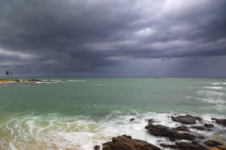 Beautiful sea stormy landscape over rocky coastline in Indian ocean