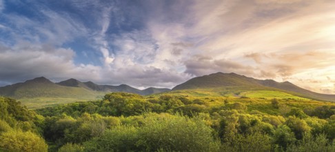 Large panorama with amazing sunset and dramatic sky at the foothill of Carrauntoohil mountain,