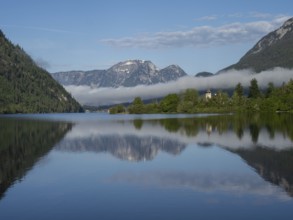 Morning atmosphere, reflection, early morning fog over the Grundlsee, panoramic shot,