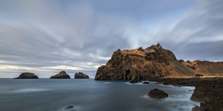 The coast and the ocean of Vestmannaeyjar island and the Elephant rock, Iceland, Europe