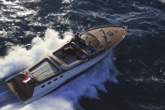 Aerial view sports boat J Craft 42 Torpedo R at full speed on the Cote d'Azur, luxurious motorboat