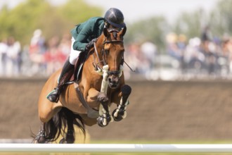 Abdulrahman Alrajhi from Saudi Arabia and riding Heartbeat W, compete in the 1.60m Grand Prix